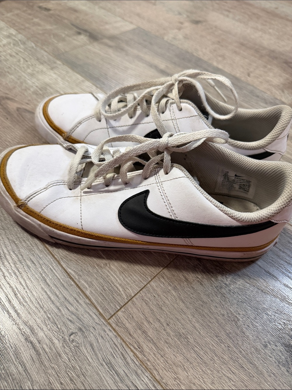 Nike White Low-Top Sneakers with Black Swoosh and Tan Trim